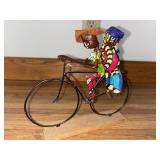 folk art sculpture two people riding a bicycle