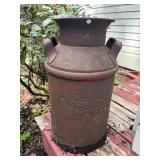 VTG Milk Can used as yard art      (FrontOUTSIDE)