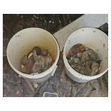 Buckets with lead weights- under house