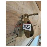 Two small pulleys - right of garage