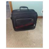 Carry on suitcase (downstairs bedroom)