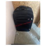 Samsonite black suitecase (downstairs bedroom)