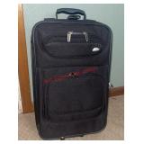 Samsonite suitcase (downstairs bedroom)