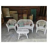 Wicker lawn furniture, some damage, left of the
