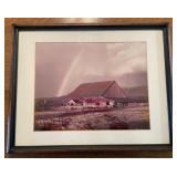 framed photograph or print depicting a red barn