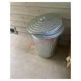 metal trash can (first house porch )