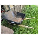 Ace black wheel barrel       (Right Side of barn)