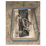 vintage black leather ice skates and football