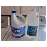 Full bottle of bleach and bottle of vinegar