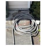 Hose (by garage door)