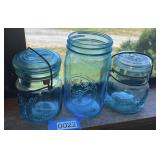 Three blue glass mason jars (living room)