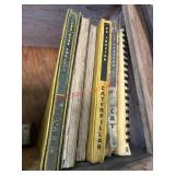 Cat manuals lot             ( Left Side of shop)