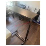 Adjustable Table          (master Bedroom)