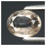 0.57ct 5.5x4.3mm Oval Natural Light Champagne Zirc