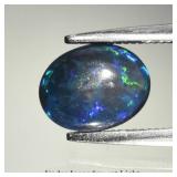 0.62ct 7.7x6mm Oval Cabochon Natural Black Opal -