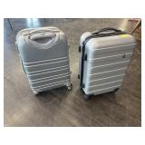 2 SMALL HARD SIDED ROLLING  SUITCASES