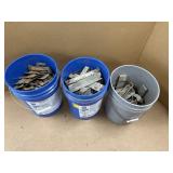 3 BUCKETS FULL OF CONCRETE BRACKETS