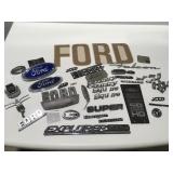 Vintage Ford emblems, decal, and other items