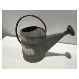 Vintage galvanized watering can