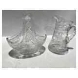 Cut glass pitcher in basket, heavy