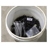 Bucket of miscellaneous hardware, screws, nails