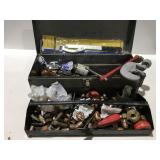 Metal toolbox with plumbing items
