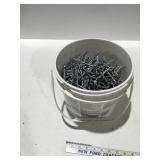 Bucket of 3 1/2 inch spiral nails