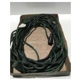 Two green outdoor extension cords