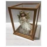Porcelain praying doll in case