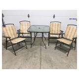 Outdoor table and folding chairs