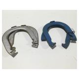 Metal champs throwing horse shoes