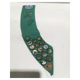 Girl Scout badges on sash