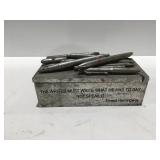 Aluminum pencil box with quote from Ernest