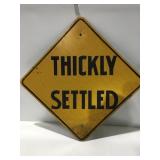 Thickly settled road sign