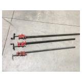 Three pipe clamps