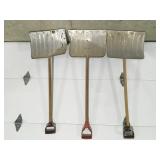 3 metal snow shovels 2 have some damage