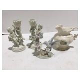 Candlesticks, tea, pot, and decor