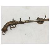 Toy gun hat, coat rack