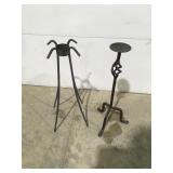 Metal candle stick in gazing ball stand