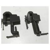2 small clamp on vices