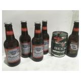 Large Budweiser bottles and Becks barrel