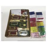 Plastic clothes pins, brass poles in cardholders