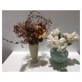 2 floral arrangements in vases