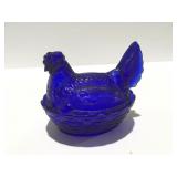 Cobalt blue glass hen on a nest