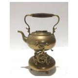 Brass color tea pot with burner