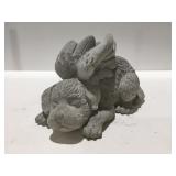 Concrete dog with wings