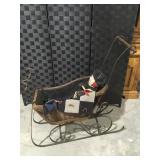 Vintage wicker sled with baby doll