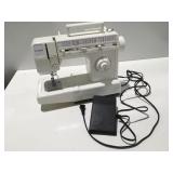 Singer sewing machine powers on & moves
