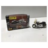 Two toy motorcycle
