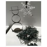 Metal snowman, decor, and Christmas lights
